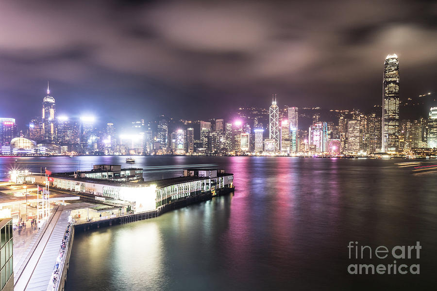 Stunning view of Hong Kong island skyline and the Star ferry pie Photograph by Didier Marti