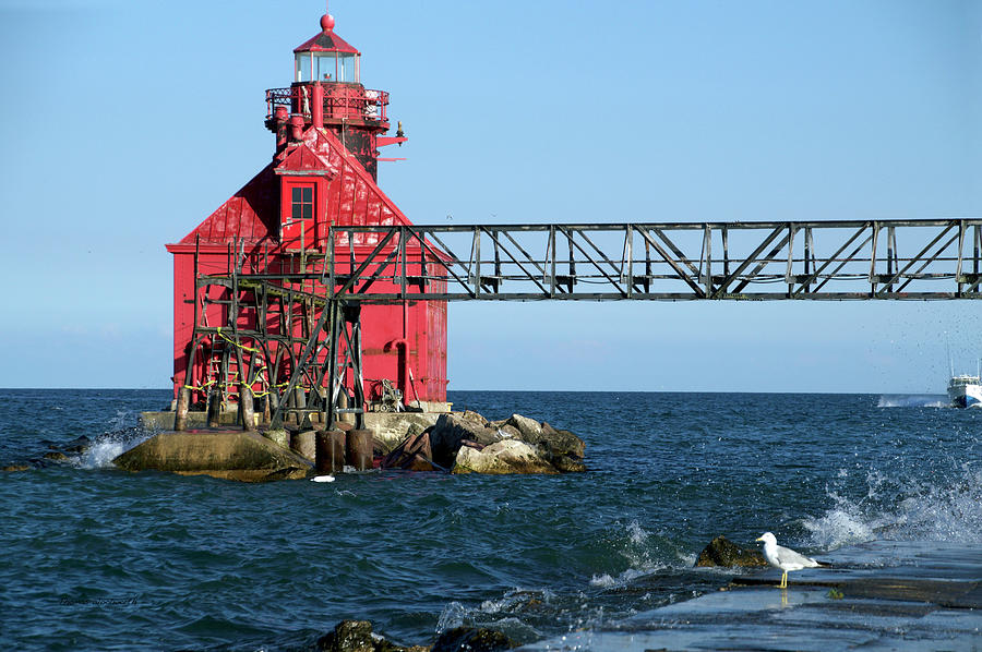 Sturgeon Bay Canal North Pier Lighthouse Wisconsin With Boat Photograph by Thomas Woolworth