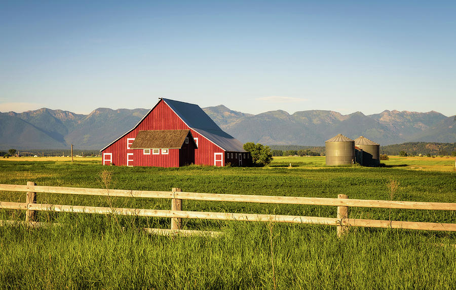 Summer evening with a red barn in rural Montana Photograph by Miroslav Liska