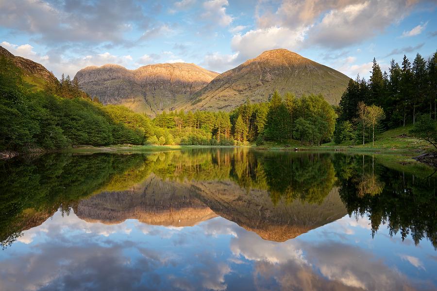 Summer reflections at Torren Lochan Glencoe Photograph by Stephen Taylor