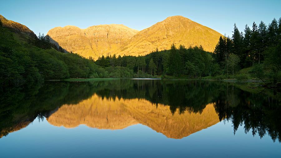 Summer reflections in Glencoe Photograph by Stephen Taylor