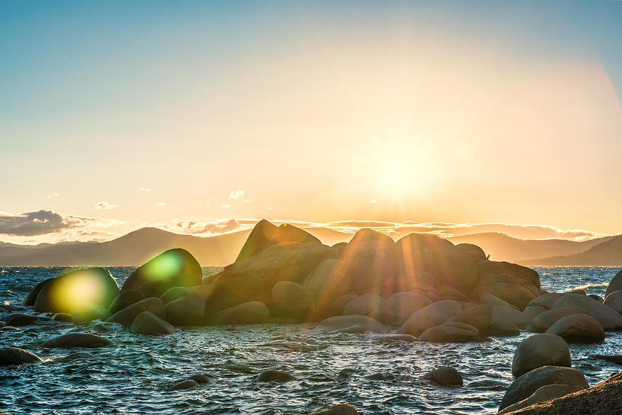 Summer Sunset Over Rocks on Lake Tahoe East Shore near Bonsai Rock with Lens Flare and Mountains Photograph by Brian Ball