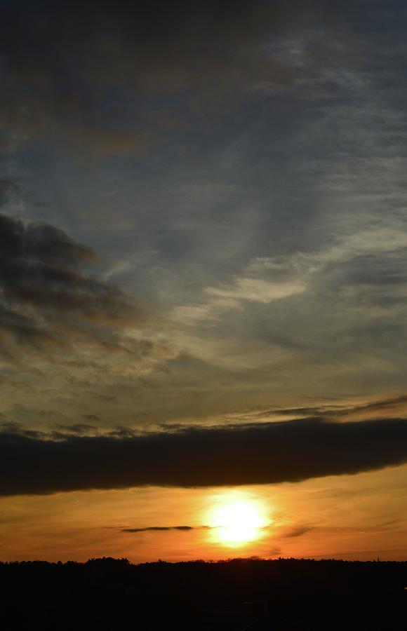 Sun Below A Cloud  Photograph by Lyle Crump