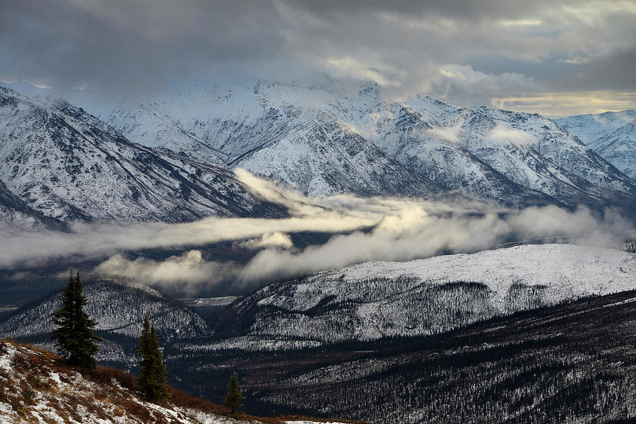 Sun low clouds over Middle Fork Koyakuk river valley separating  Photograph by Reimar Gaertner