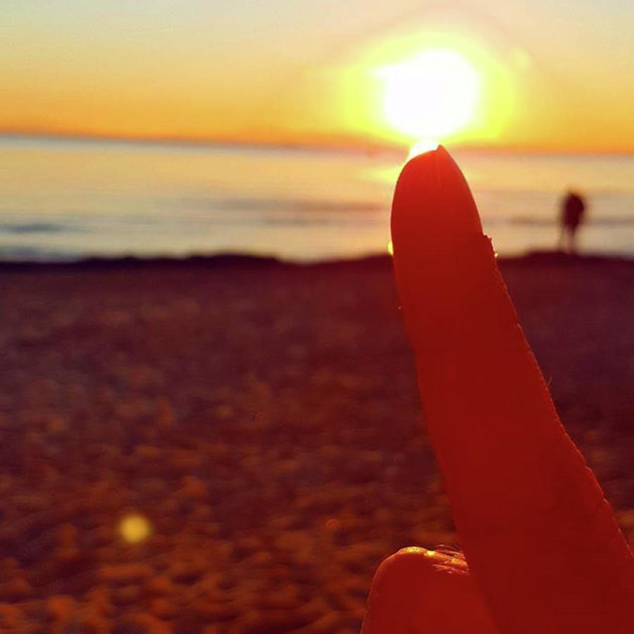 Sunset Photograph - Sun On Finger by Alessio Cicalini