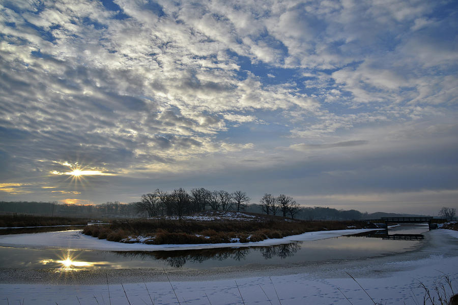 Sun Peaks Through Sunrise Clouds in Glacial Park Photograph by Ray Mathis
