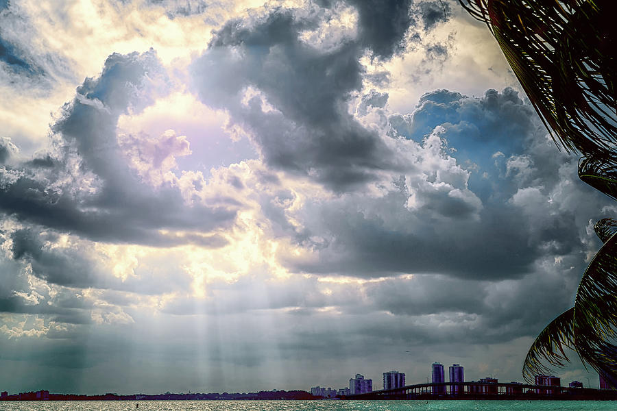 Sun rays over Miami Photograph by Camille Lopez