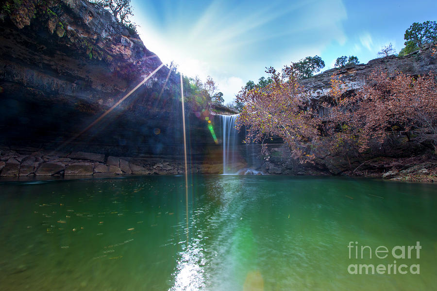 Sun Rays Photograph - Sun rays shimmer through the cliffs at Hamilton Pool Nature Preserve as a beautiful 50-foot waterfall cascades down the pool by Dan Herron