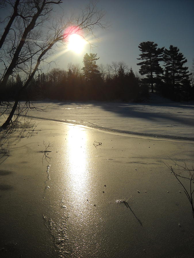 Sun Reflecting off River Ice Photograph by Kent Lorentzen
