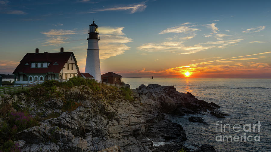 Sun Rising at Portland Head Light Photograph by Jerry Fornarotto