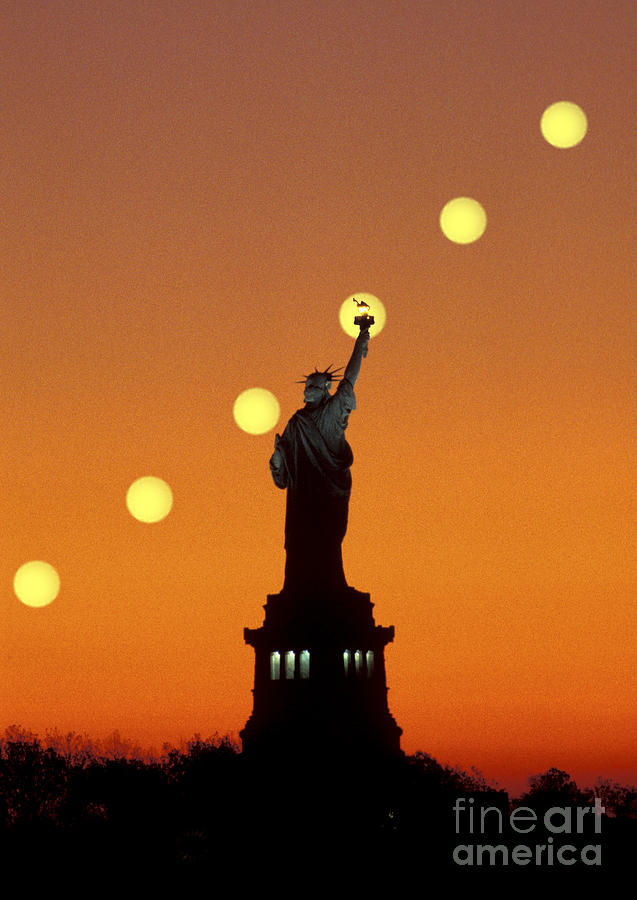 Sun Rising Behind Statue Of Liberty Photograph by Larry Landolfi