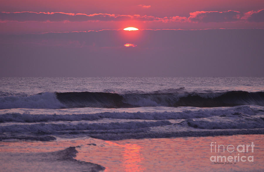 Sun rising through the violet cloud bank Photograph by Julianne Felton