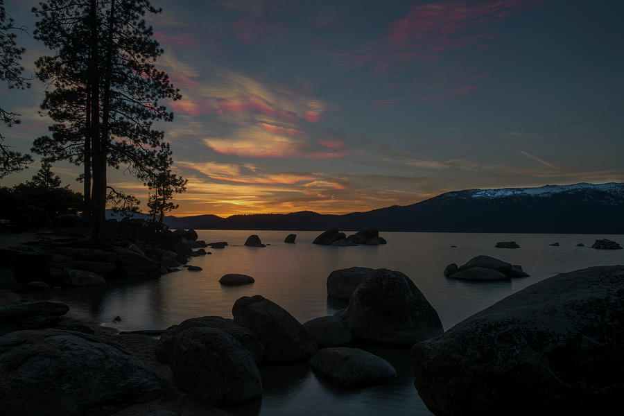Sun setting at end of day at Lake Tahoe Photograph by Dan Friend