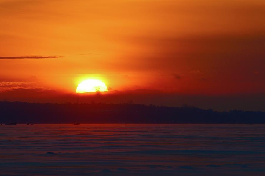 Sun Setting Behind A Cloud  Photograph by Lyle Crump