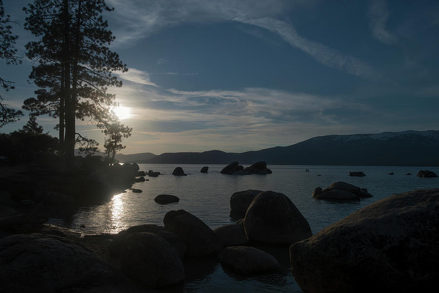 sun setting over the mountains at Lake Tahoe Photograph by Dan Friend