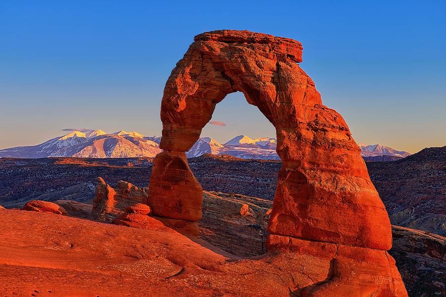 Sundown on Delicate Arch Photograph by Greg Norrell