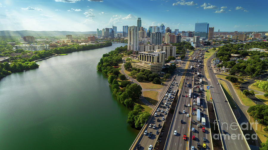 Rush Hour Movie Photograph - Sunrays paint the Austin Skyline as rush hour traffic picks up o by Dan Herron