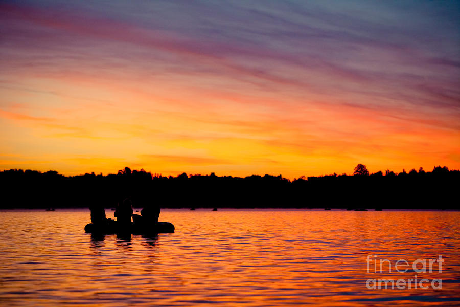 Sunrise above lake water and boat summer time Latvia Ezera skanas Photograph by Raimond Klavins