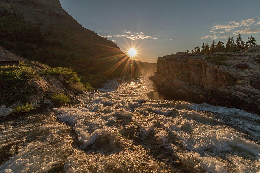 Sunrise at Swiftcurrent Falls Photograph by Tony Hake