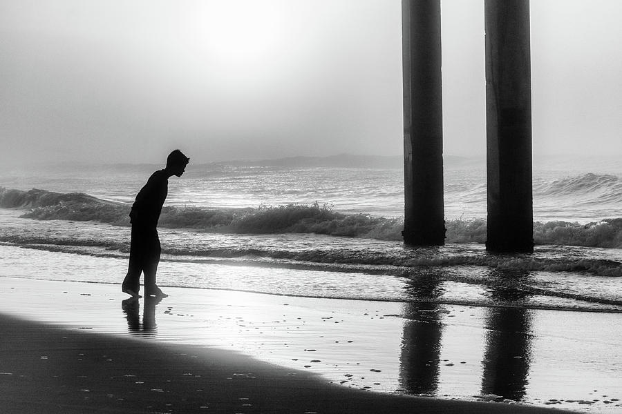 Sunrise Boy in Foggy Beach Photograph by John McGraw