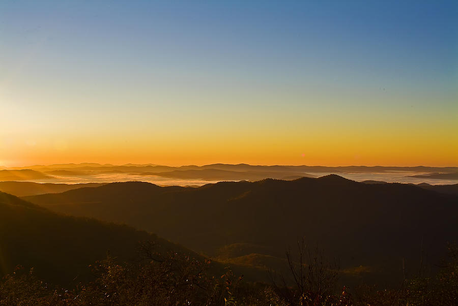 Sunrise In The Mountains On A Cloudless Day Photograph by Michael Whitaker
