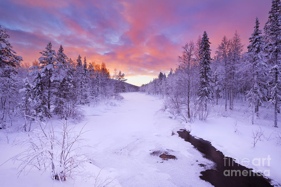 Sunrise over a river in winter near Levi in Finnish Photograph by Sara Winter - Pixels