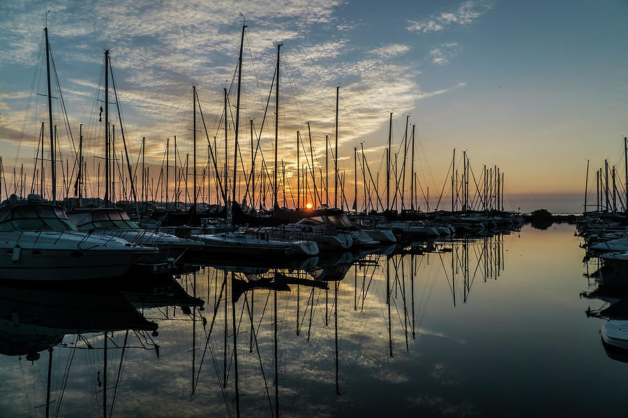 sunrise though the masts of Chicago sail boats Photograph by Sven Brogren