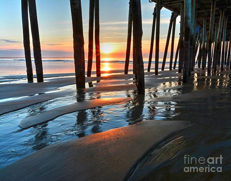 Sunrise Through the Pier Photograph by Steve Brown