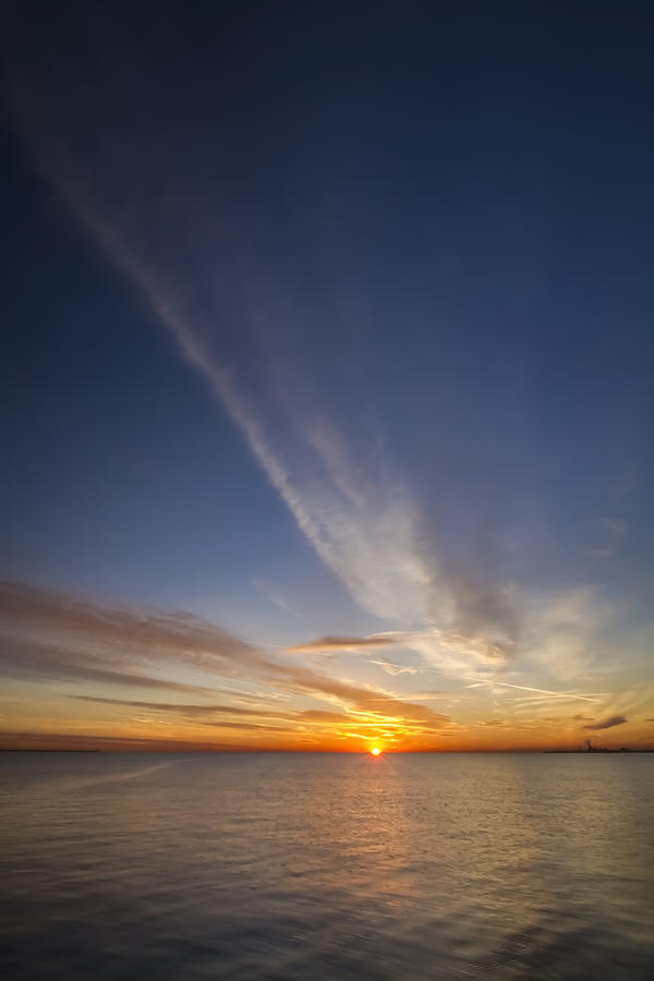 Sunrise with vertical clouds Photograph by Sven Brogren