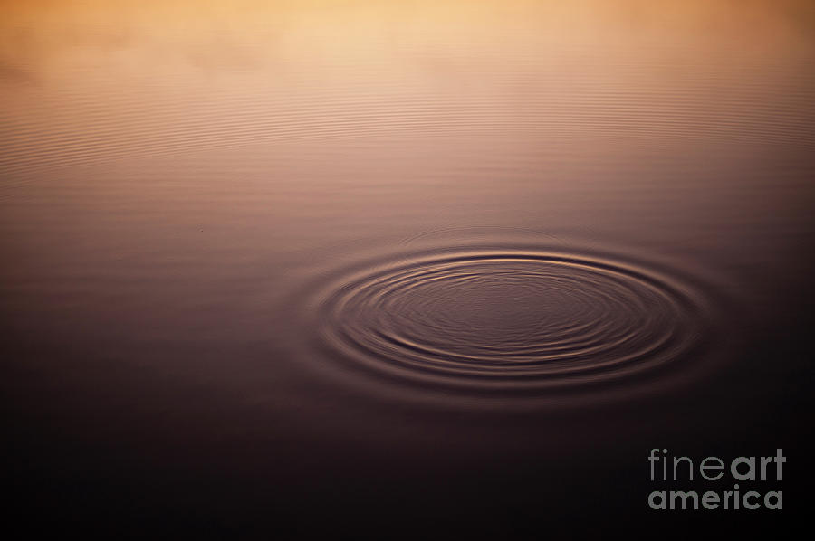 Sunrise with Water ripples in Still Water Photograph by Jim Corwin