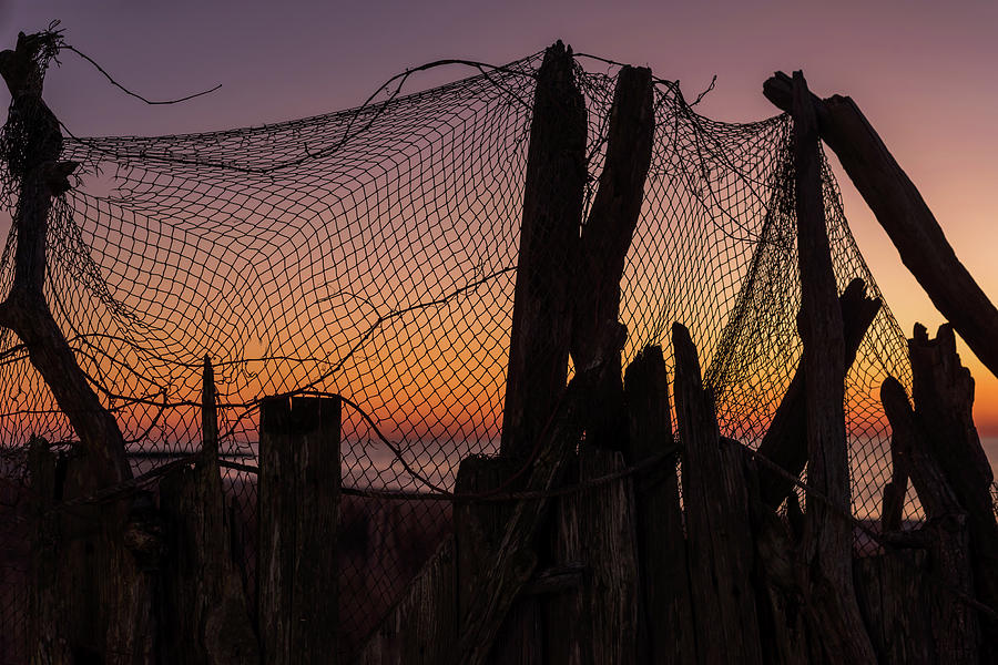 Sunset and Fishing Net Cape May New Jersey Photograph by Terry DeLuco