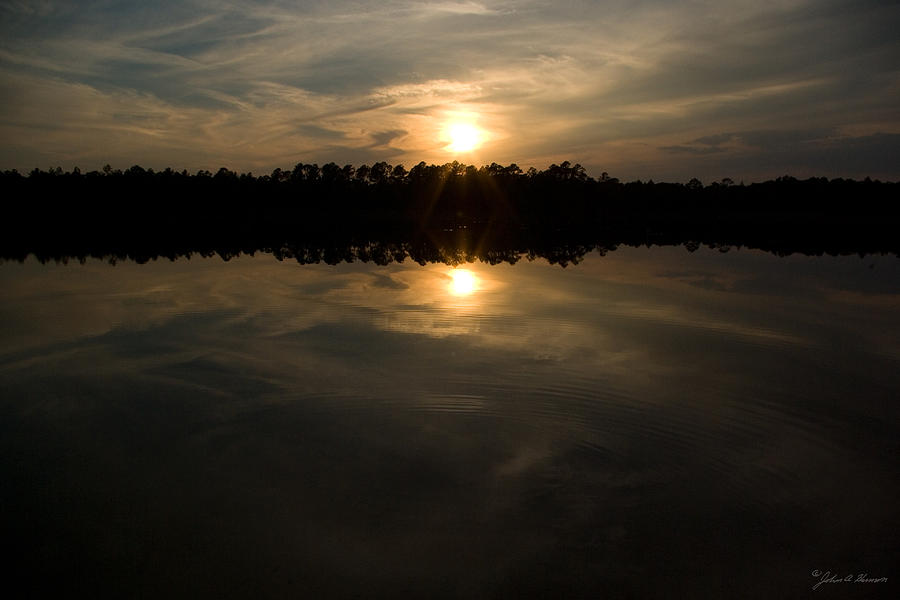 Sunset at Clearwater Lake Ocala Florida Photograph by John Harmon