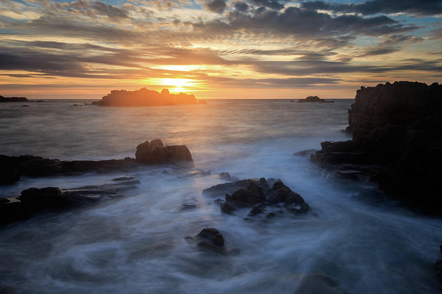 Sunset at Cobo Bay Photograph by Chris Smith