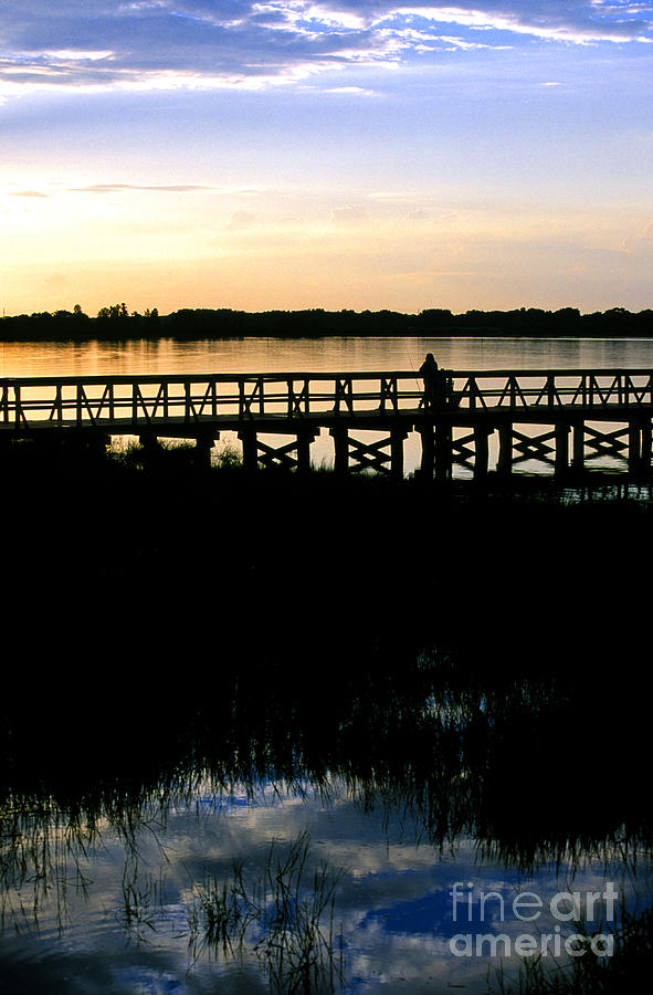 Sunset at Lake Mineola in Clermont Florida Photograph by William Kuta