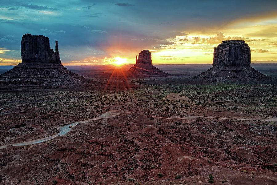 Sunset at Monument Valley Navajo Tribal Park Three Mittens Arizona Photograph by Silvio Ligutti