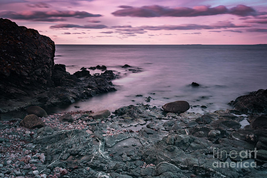 Sunset at rocky beach Photograph by Sophie McAulay