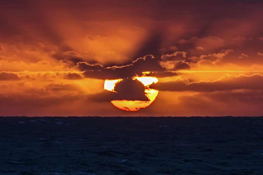 Sunset at Sea Photograph by John Haldane