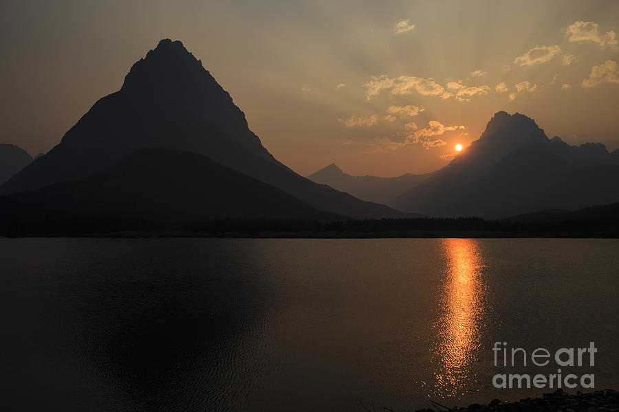 Sunset at Swiftcurrent Lake Photograph by Dennis Hedberg