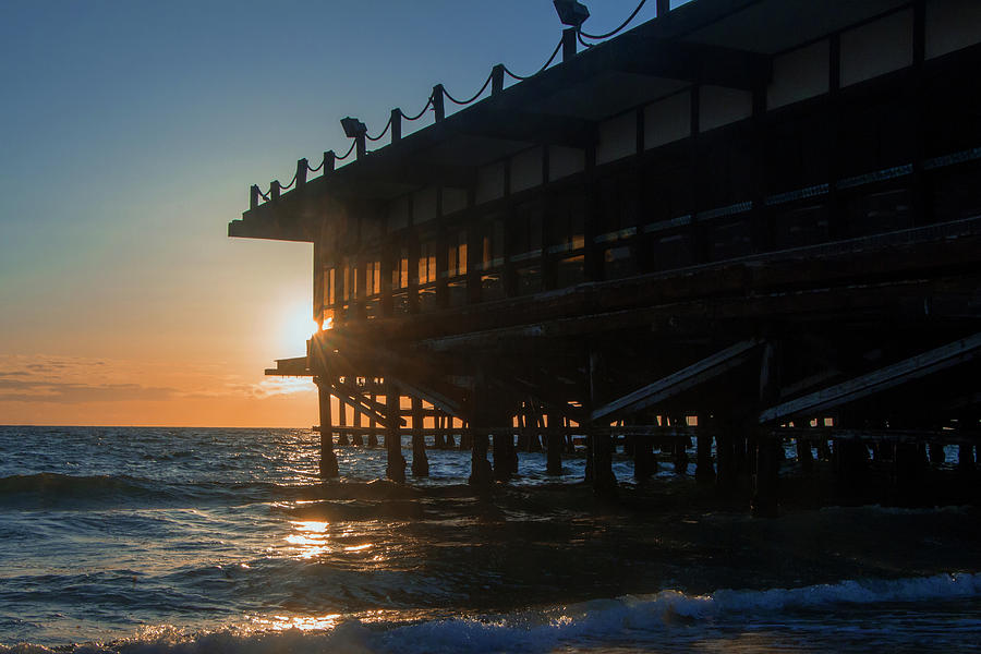 Sunset at the Pier Photograph by Ed Clark