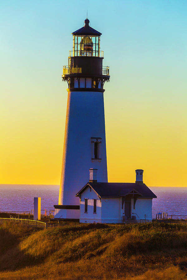 Sunset At Yaquina Head Lighthouse Photograph by Garry Gay