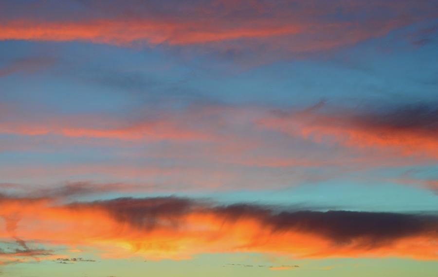 Sunset Clouds In Blue Sky  Photograph by Lyle Crump