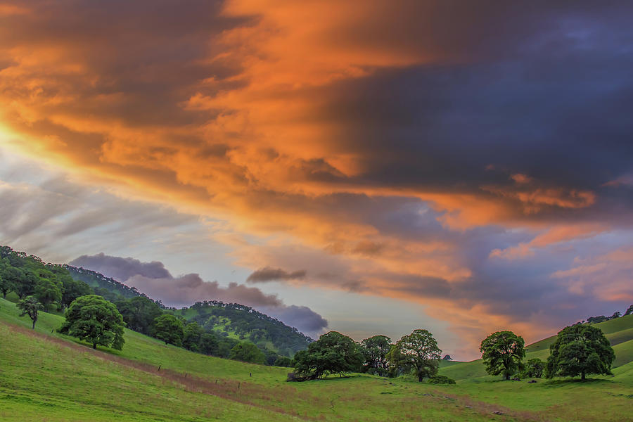 Sunset Clouds Over Green Hills Photograph by Marc Crumpler
