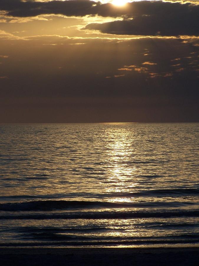 Sunset - Dramatic a spotlight on the Ocean Photograph by Holly Eads ...