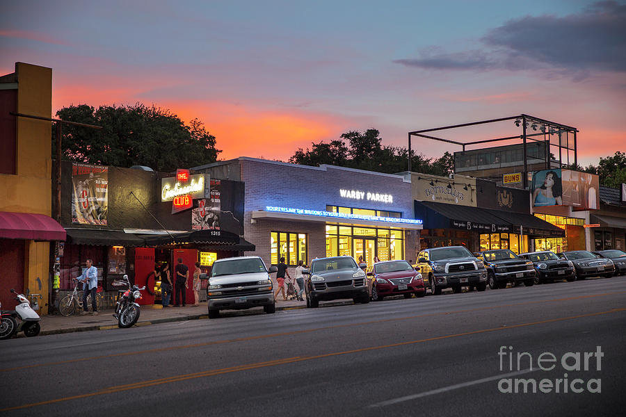 Sunset Photograph - Sunset falls on South Congress Avenue, a popular shopping and live music district in downtown Austin, Texas by Dan Herron