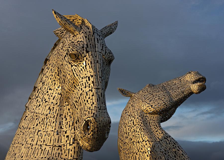 Sunset light at the Kelpies Photograph by Stephen Taylor