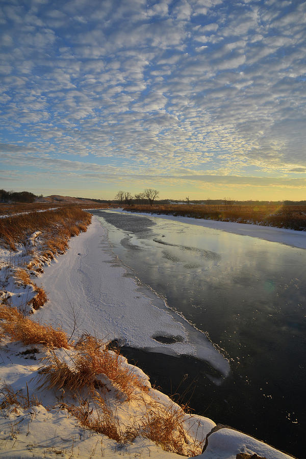 Sunset on Frozen Nippersink Creek in Glacial Park Photograph by Ray Mathis