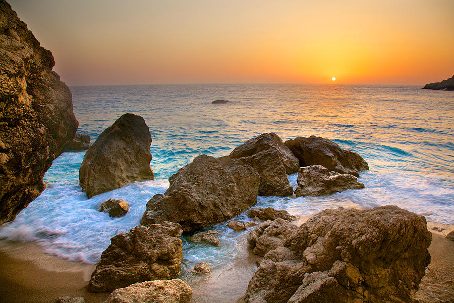 Holiday Photograph - Sunset on rocky beach on paradise island Greece by Sandra Rugina