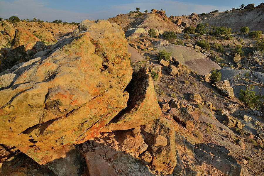 Sunset on the Boulders of the Bentonite Site Photograph by Ray Mathis