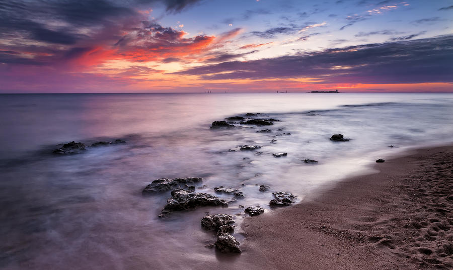 Sunset on the coast of Chiclana Photograph by Hernan Bua