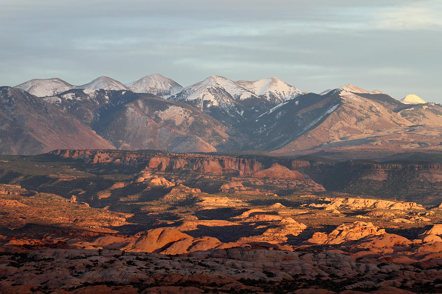 Sunset on the La Sal mountains from Arches National Park Photograph by Pierre Leclerc Photography